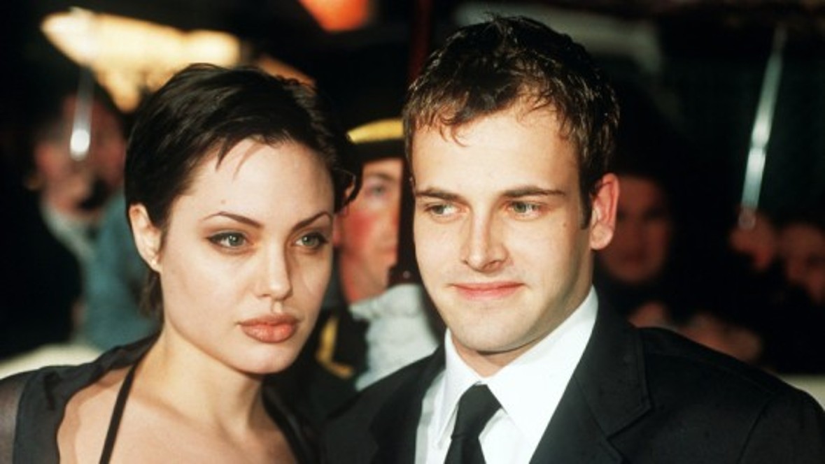 Angelina Jolie divorces husband number one, Jonny Lee Miller. Via Billy Bob Thornton (husband no.2) she finally gets together with Brad Pitt (husband no.3). Angelina Jolie divorces husband number one, Jonny Lee Miller. Via Billy Bob Thornton (husband no.2) she finally gets together with Brad Pitt (husband no.3).