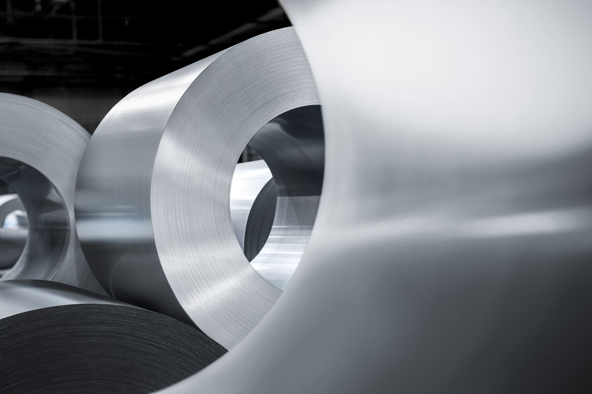 Close-up of multiple coils of powercore® electrical steel from thyssenkrupp Steel for applications in power transmission and electric mobility.