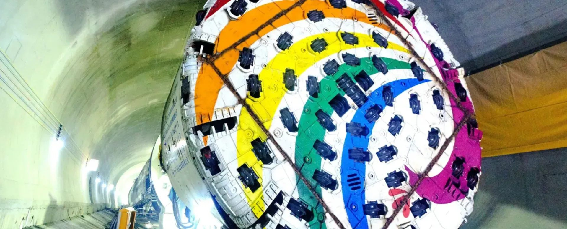 Large slewing bearing component with colorful segments, representing advanced engineering and precision manufacturing for tunnel boring machines.