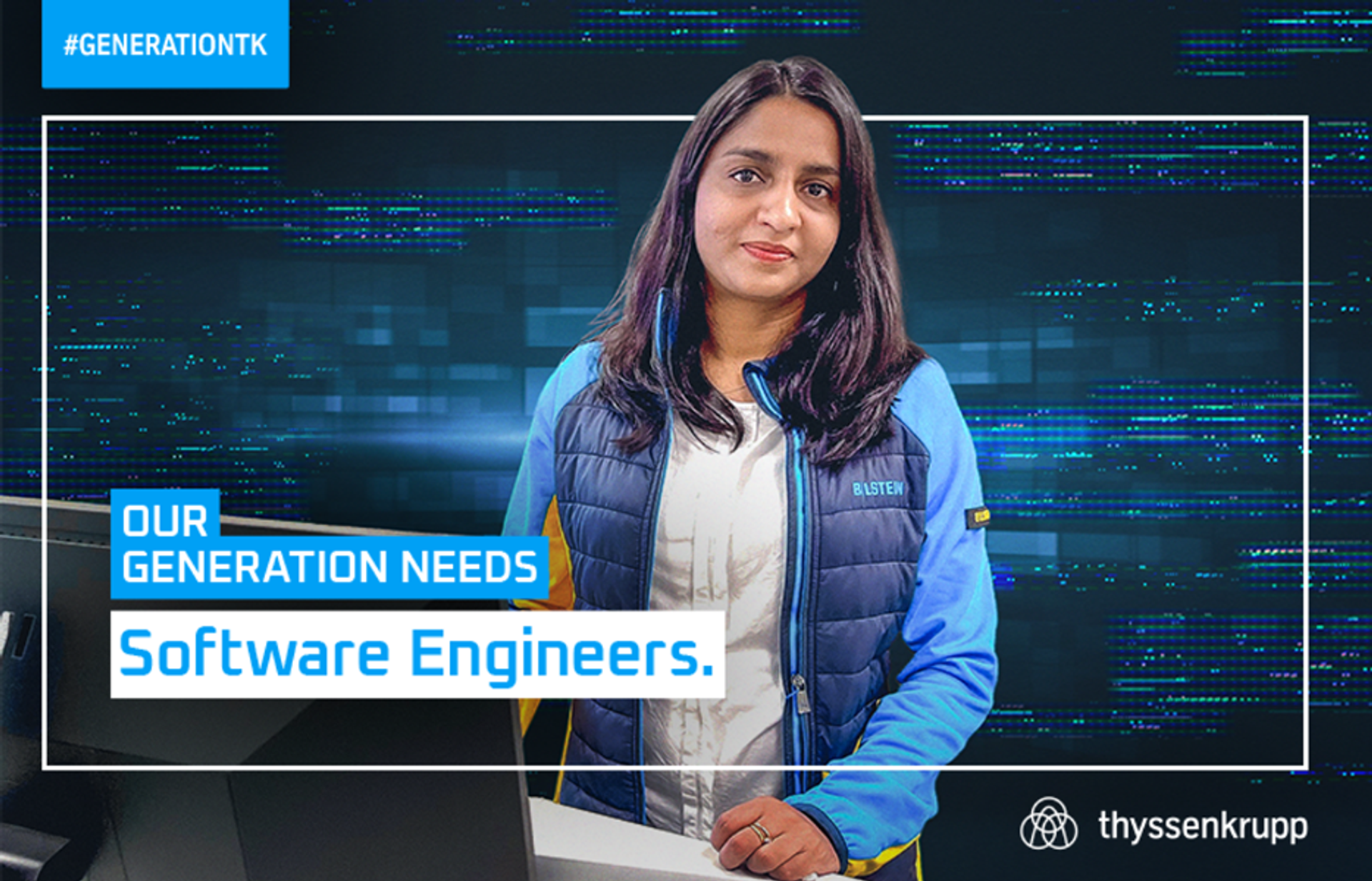 female read person with long brown hair, wearing blue work jacket, friendly facial expression, in the foreground lettering: "OUR GENERATION NEEDS software developers."