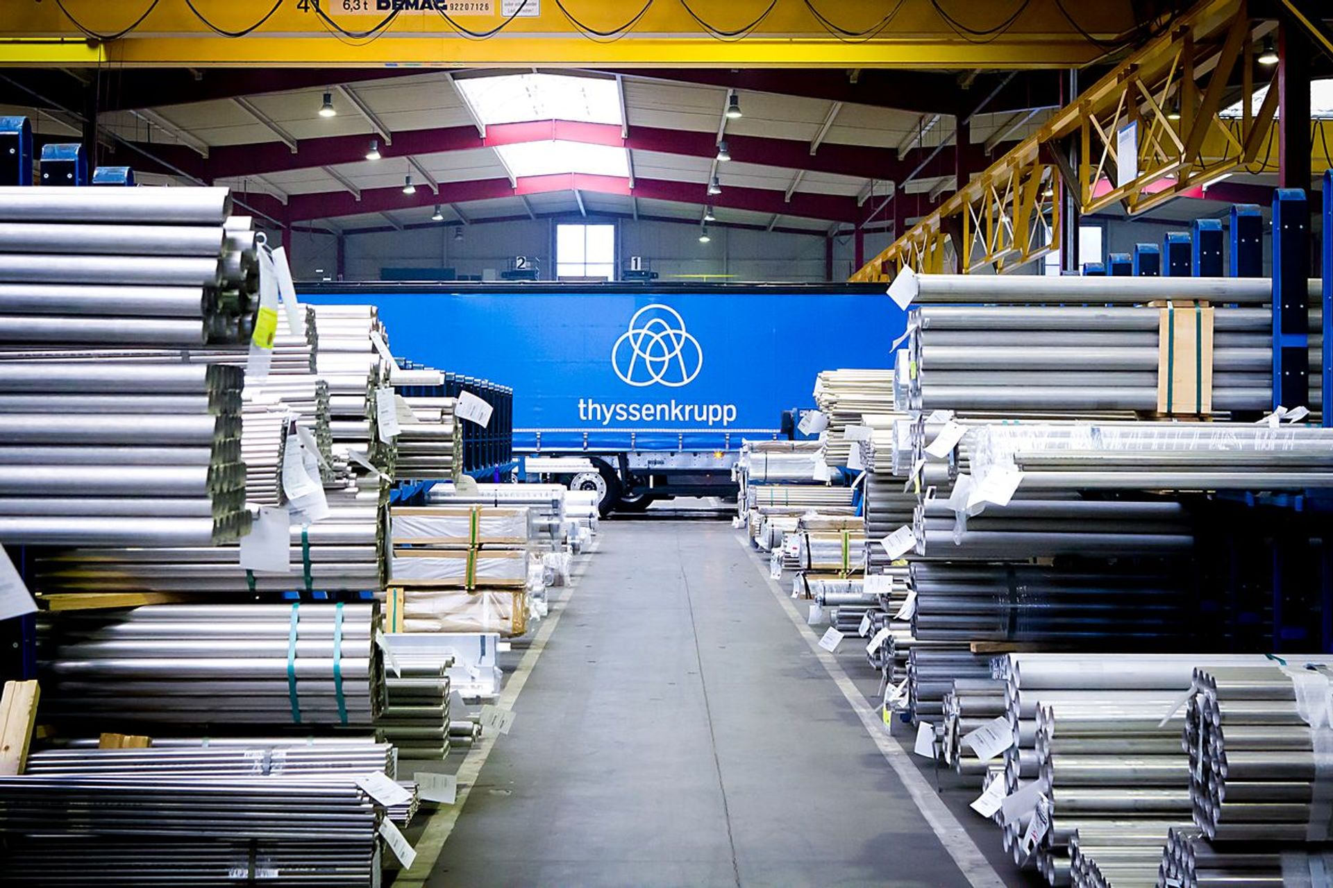 Warehouse with stacked metal materials, illustrating industrial data environments where AI supports supply chain optimization and innovation.