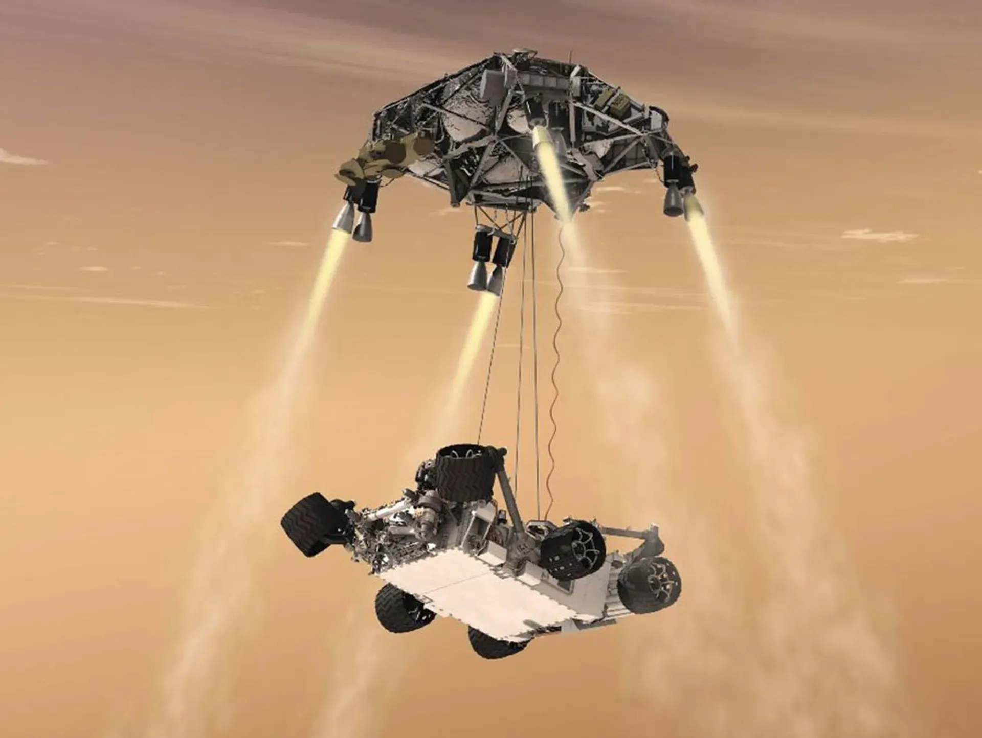 Darstellung der Marslandung: Der Rover Curiosity wird von einer schwebenden Abstiegsstufe per Sky Crane auf die Marsoberfläche abgesenkt.