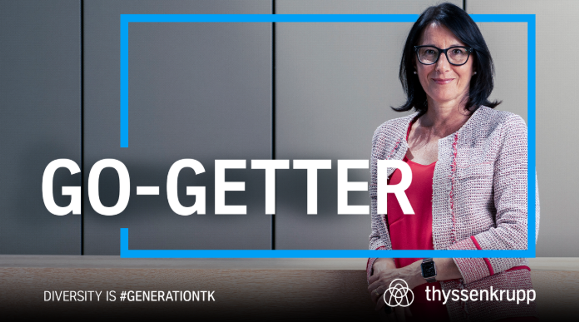 formally dressed woman in front of a light background, in the foreground the lettering "GO-GETTER"