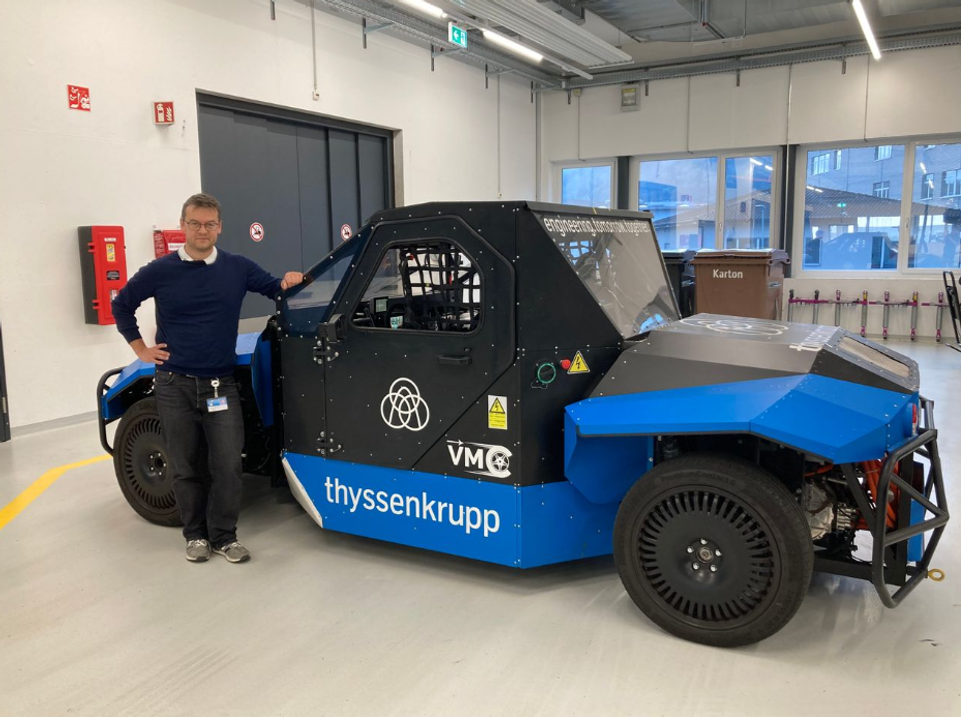 Leonard Lapis in front of a test vehicle