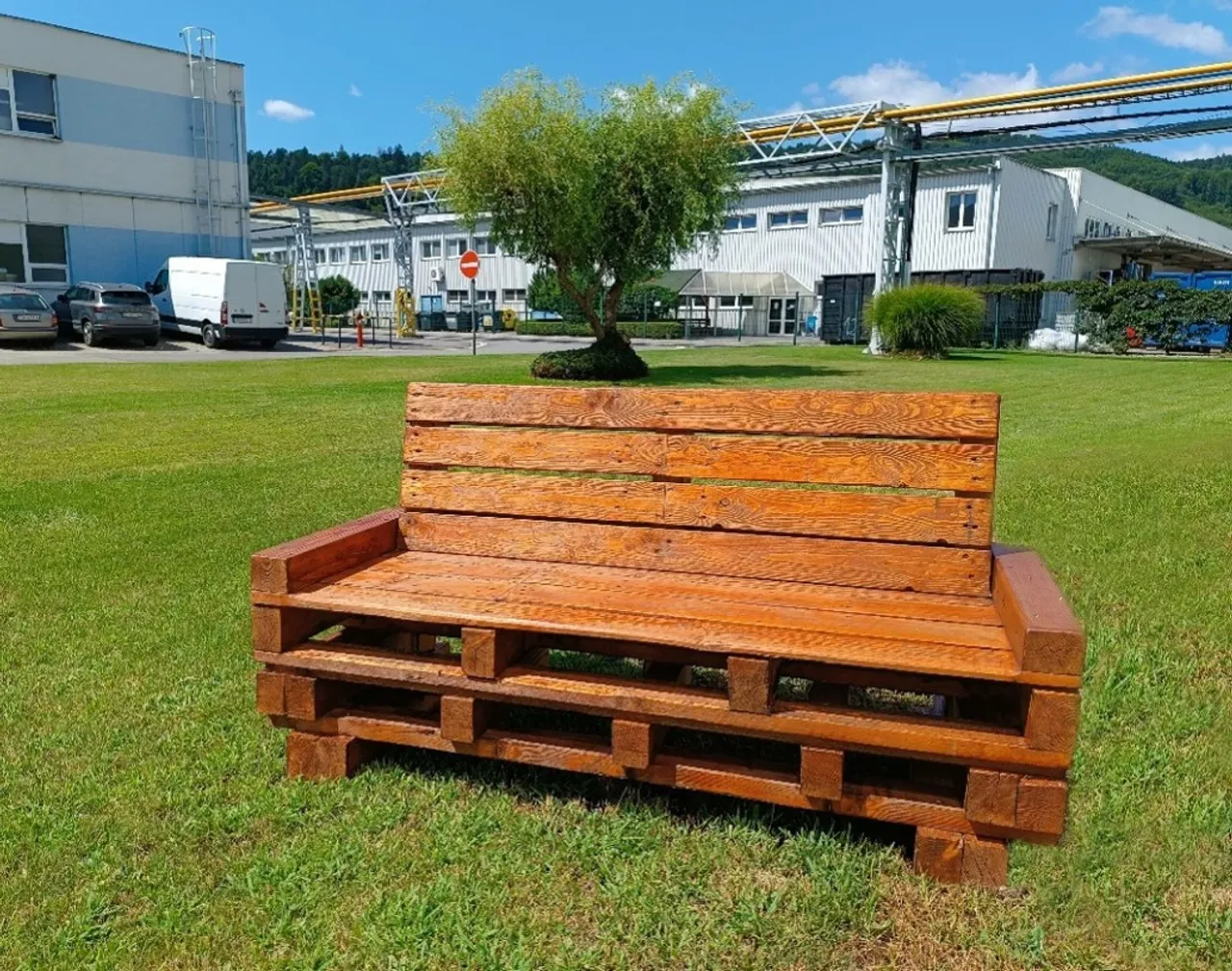 Wooden Bench on grass, blue sky