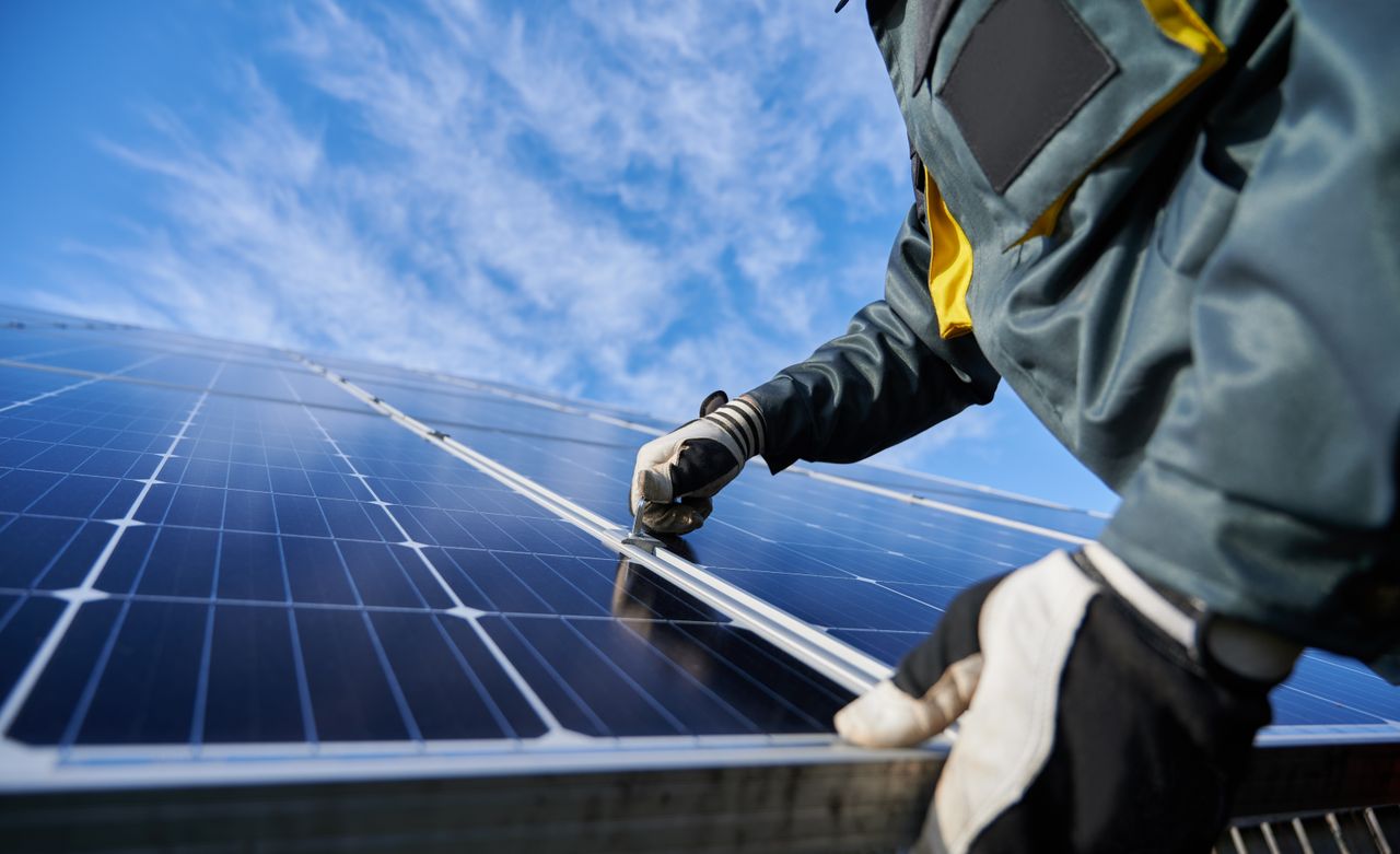 technician working on solar modules