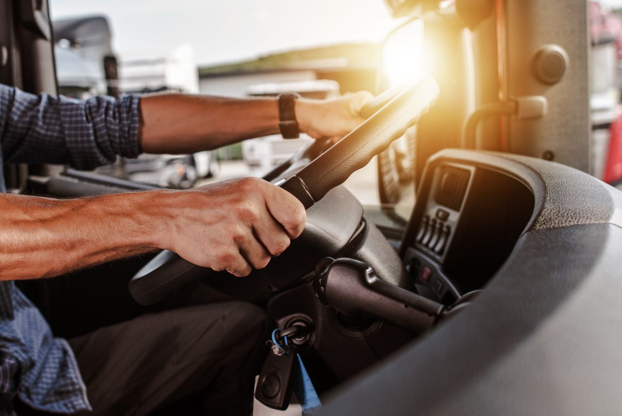 man operating a semitruck as part of a transportation supply chain solution